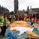 Demonstrators prepare to inflate a blimp portraying U.S. President Donald Trump, in Parliament Square, during the visit by Trump and First Lady Melania Trump in London